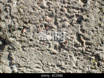 Texture of gray uneven concrete wall. Close-up, grunge background Stock Photo
