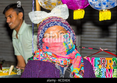 Indian woman with scarf, Kohima Night market, Nagaland, India Stock Photo