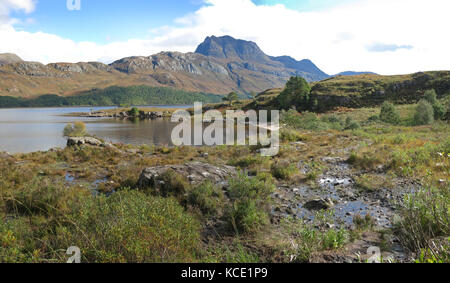 View southwest across Loch Maree to the peak of Slioch in the Scottish Highlands, UK. Shows autumn landscape. Stock Photo