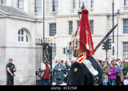 The Blues and Royals of the Household Cavalry taking part in the Dismounting Ceremony, or 4 'O' Clock Parade, at the Horse Guards, London, UK Stock Photo