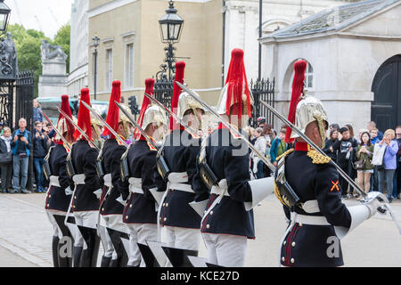 The Blues and Royals of the Household Cavalry taking part in the  Dismounting Ceremony, or 4 'O' Clock Parade, at the Horse Guards, London,  UK Stock Photo - Alamy