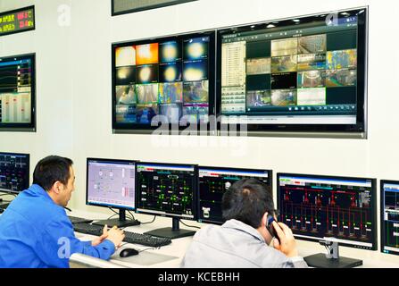 Control panels in control room of ultra modern coal fired 1,320 megawatt power plant of Tonghua Xuangang Power Station at Yuanping, Shanxi, China Stock Photo