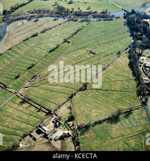 Lower Farm, Britford, Wiltshire. At Britford, just south of Salisbury on the River Avon, a complex system of leats is used to channel water over the v Stock Photo