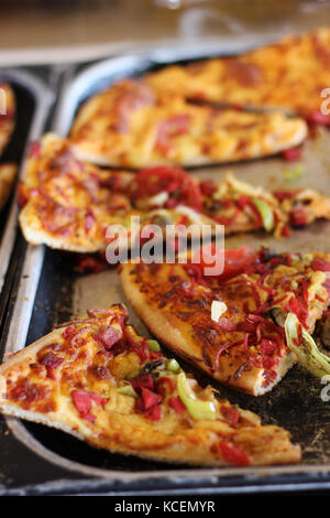 Sliced mixed pizza on the metal tray Stock Photo