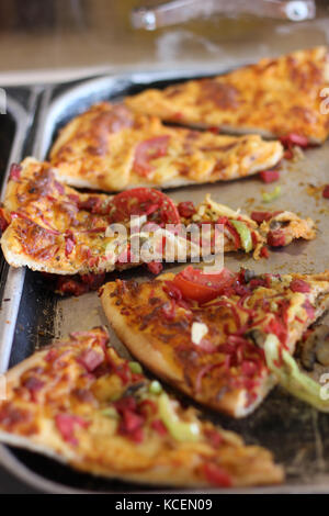 Sliced mixed pizza on the metal tray Stock Photo