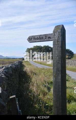 Wooden Signpost to Hebden from Yarnbury near Grassington in Wharfedale, Yorkshire Dales National Park, England, UK. Stock Photo