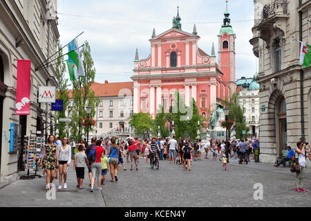 main ljubljana street with saint francis church in ljubljana and tromostovje in the back summertime city center Stock Photo