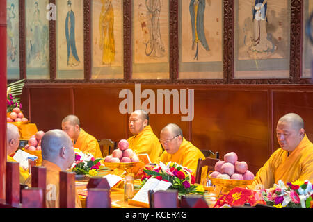 Monks' Prayer meeting in Wannian Temple, Mount Emei, Sichuan, China Stock Photo