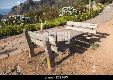 Two outdoor benches and table in Mountain village Serra De Agua of Madeira island, Portugal Stock Photo