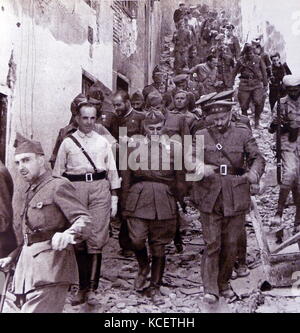Spanish Civil War nationalist leaders: Generals Verela, Franco and Moscardo in Toledo after the rebels capture the city of Toledo 1937. he Siege of the Alcázar was a highly symbolic Nationalist victory in Toledo in the opening stages of the Spanish Civil War. The Alcázar of Toledo was held by a variety of military forces in favour of the Nationalist uprising. Militias of the parties in the Popular Front began their siege on July 21, 1936. The siege ended on September 27 with the arrival of the Army of Africa under Francisco Franco. Stock Photo