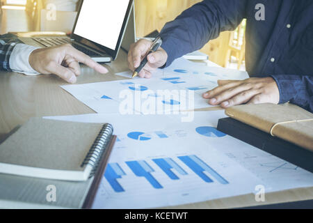 Business teamwork process, Businessmen hands pointing at document during explanation of new plan project data at meeting. Stock Photo
