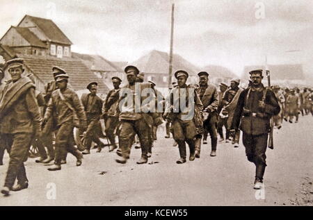World War One, Russian soldiers captured and made prisoners of war are escorted through German controlled territory. 1915 Stock Photo
