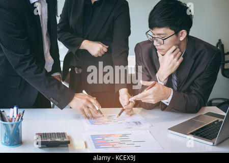 businessteam looking at report and having a discussion in office. business concept. Stock Photo