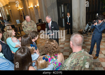 South Carolina Gov. Henry McMaster proclaims April as month of the military child along with South Carolina National Guard families at the South Carolina State House, Columbia, S.C., April 28, 2017.  April is designated as the Month of the Military Child, underscoring the important role military children play in the armed forces community. (U.S. Air National Guard photo by Tech. Sgt. Jorge Intriago) Stock Photo