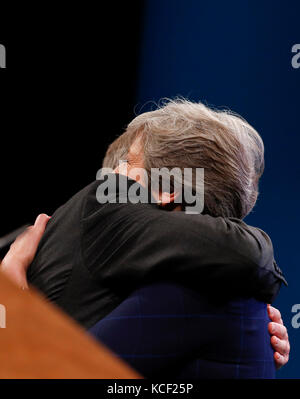 Manchester. 4th Oct, 2017. Britain's Prime Minister Theresa May is embraced by husband Philip after delivering her keynote speech on the last day of the Conservative Party Annual Conference in Manchester, Britain on Oct. 4, 2017. Credit: Han Yan/Xinhua/Alamy Live News Stock Photo