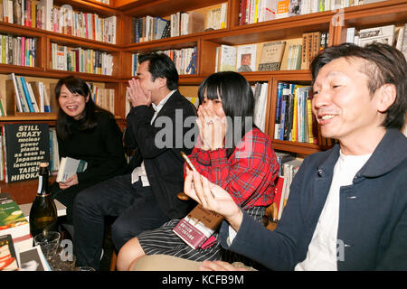 Tokyo, Japan. 5th Oct, 2017. Fans of Japanese author Haruki Murakami react after hearing the result of the Nobel Literature prize, which went to Japan born British novelist Kazuo Ishiguro, at the gallery-bookshop Rokujigen in Tokyo on October 5, 2017, Tokyo, Japan. Kazuo Ishiguro, who also has a following in the country of his birth, was not the first choice for these fans who have been waiting for Murakami to win the prize. Credit: Rodrigo Reyes Marin/AFLO/Alamy Live News Stock Photo