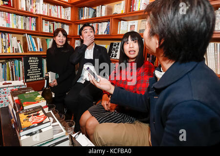 Tokyo, Japan. 5th Oct, 2017. Fans of Japanese author Haruki Murakami react after hearing the result of the Nobel Literature prize, which went to Japan born British novelist Kazuo Ishiguro, at the gallery-bookshop Rokujigen in Tokyo on October 5, 2017, Tokyo, Japan. Kazuo Ishiguro, who also has a following in the country of his birth, was not the first choice for these fans who have been waiting for Murakami to win the prize. Credit: Rodrigo Reyes Marin/AFLO/Alamy Live News Stock Photo