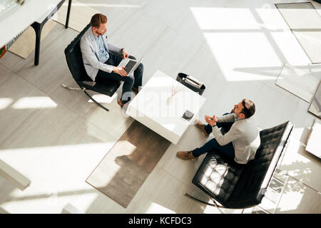 Business meeting in lobby Stock Photo