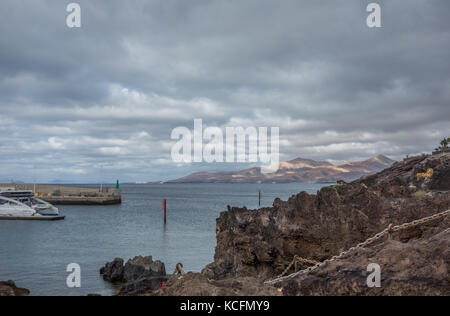 Views across Puerto del Carmen seafront and harbour, Lanzarote Stock Photo