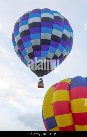 Hot air balloons being inflated and taking off from The Knavesmire York, United Kingdom Stock Photo
