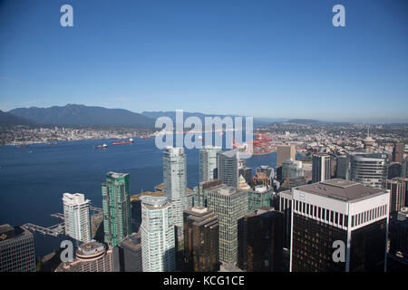 North America, Canada, British Columbia, Vancouver, high angle view of Port area of Vancouver. City skyline, waterfront and harbour area in distance Stock Photo