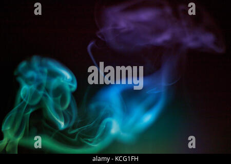 Colorful smoke on black background Stock Photo