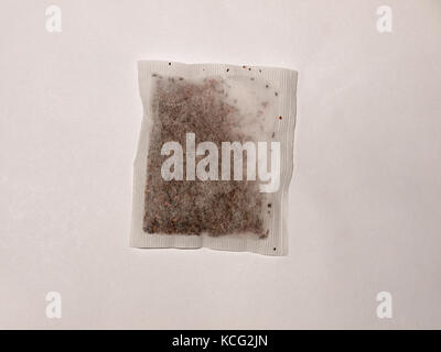 single dry unused herbal tea bag on a white background; Essex; England; UK Stock Photo