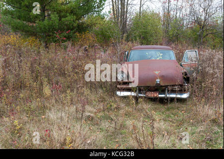 Abandoned classic Ford sedan Stock Photo
