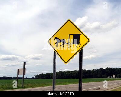 A warning sign in Michigan, USA that depicts beware Amish Buggies on the road Stock Photo