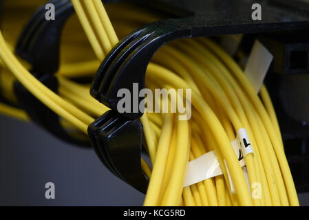 Server rack with optical patch cord cables close up Stock Photo