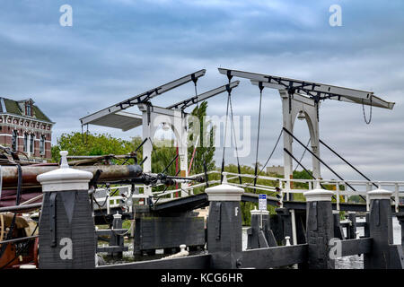 Old white bridge: Partial view of the harbor of Leiden, Netherlands Stock Photo