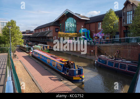 Canal boats moored on the Oxford Canal at Castle Quay Shopping Centre Banbury Oxfordshire England Stock Photo