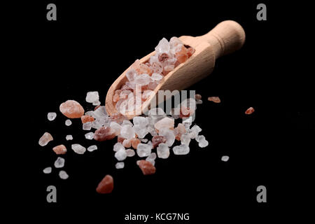 Wood Spice Spoon With Himalayan Salt on Black Background Stock Photo