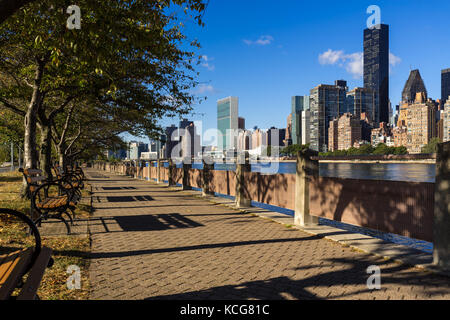 Morning view of Manhattan Midtown East skyscrapers from Roosevelt Island with the East River. New York City Stock Photo