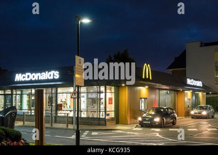 McDonald's drive thru restaurant at night, West Bridgford, Nottinghamshire, England, UK Stock Photo