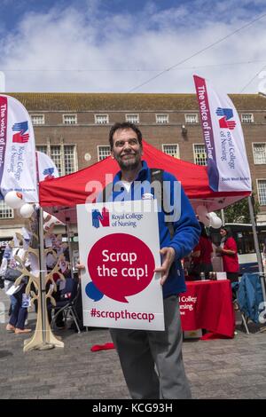 Nurses manning the Scrap the Cap RCN stand  in Exeter  July 17 Stock Photo