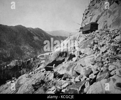 United States of America, the track of the Midland Railroad leads through wildly rugged, bizarre and rocky countryside, the Gates of Hell, the Pikes Peak Route in the state of Colorado, digital improved reproduction of a historical photo from the (estimated) year 1899 Stock Photo