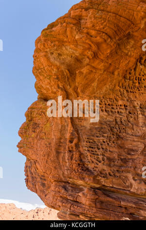 A profile shot of a rock formation that looks like a person whistling. Stock Photo