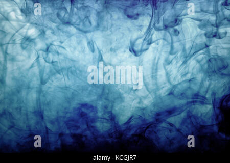 Abstract background made out of blue ink in water Stock Photo
