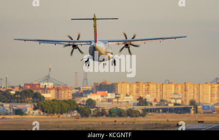 Propeller plane landing in the airport Stock Photo