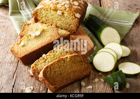 Gluten free zucchini loaf cake closeup on wooden background. Horizontal Stock Photo