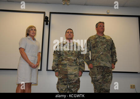 U.S. Army Lt. Col. Michael H. Murphy III, State Military Judge, South Carolina Army National Guard, is promoted to the rank of Colonel at a ceremony held at the Adjutant General’s building in Columbia, South Carolina, August 6, 2017. (U.S. Army National Guard photo by 1st Lt. Cody I. Denson) Stock Photo