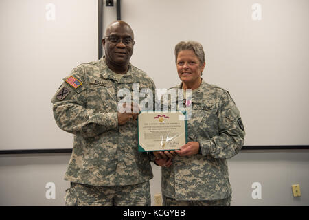 U.S. Army Sgt. 1st Class Kelsie Temples is honored on the day of her retirement at a ceremony held at the TAG complex in Columbia, South Carolina, October 3, 2017. Temples was a member of the Women's Army Corps (WAC) when she enlisted in 1976 and served 4 years active duty Army and 17 years South Carolina Army National Guard in multiple assignments, including Finance Non Commissioned Officer for the Joint Force Headquarters Fiscal Accounting Section as well as a Military Pay Clerk for the Headquarters State Area Command. (U.S. Army National Guard photo by Spc. Chelsea Baker) Stock Photo