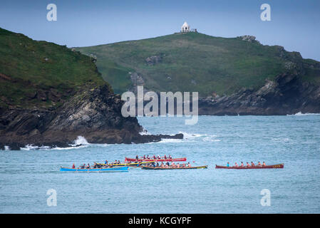 Gig racing - traditional Cornish Pilot Gigs racing off the coast of Newquay in Cornwall. Stock Photo