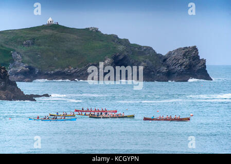 Gig racing - traditional Cornish Pilot Gigs racing off the coast of Newquay in Cornwall. Stock Photo