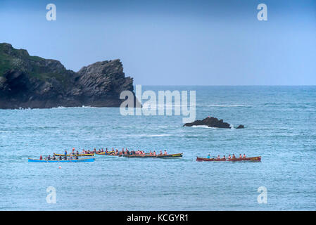 Gig racing - traditional Cornish Pilot Gigs racing off the coast of Newquay in Cornwall. Stock Photo