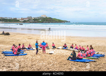 Beginners attending a surfing lesson - Surf Betty’s Festival a festival held in Newquay to help empower women through surfing and fitness. Cornwall. Stock Photo