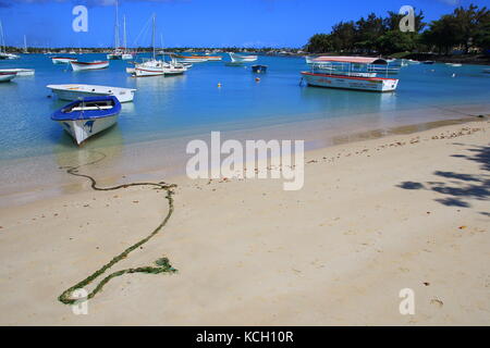 Grand-baie, Mauritius - pleasure and fishing craft moored on the beach of this town in the Riviere du Rempart District in the north of the island Stock Photo