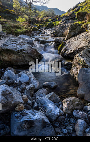 Small waterfalls and rapids, Squat Beck, Rannerdale Knotts near Crummock Water, Lake District, Cumbria, England, UK Stock Photo