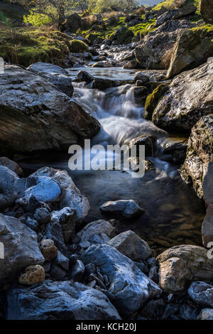 Small waterfalls and rapids, Squat Beck, Rannerdale Knotts near Crummock Water, Lake District, Cumbria, England, UK Stock Photo